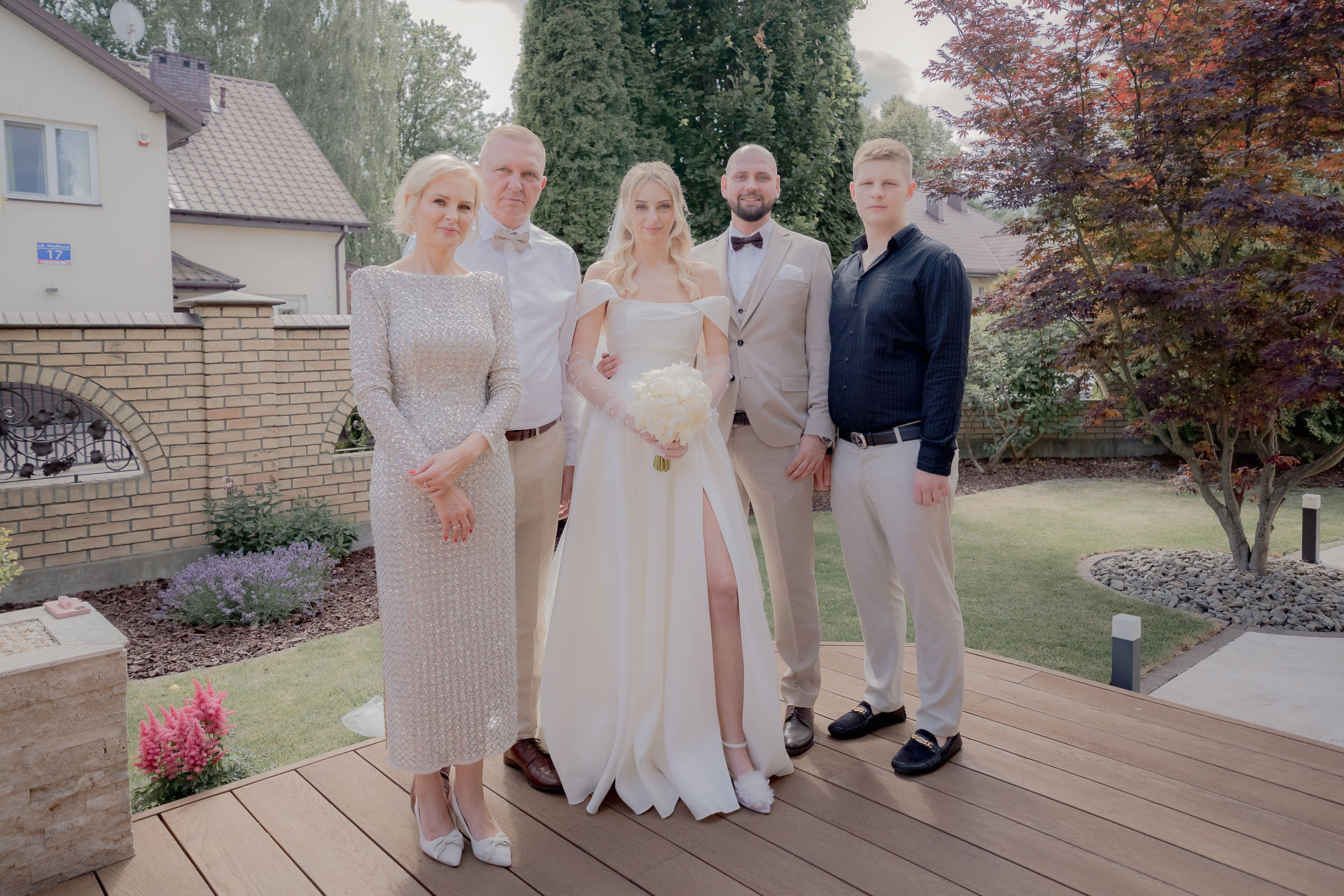 Kinga walking down the aisle toward Piotr, capturing the emotional expression on the groom's face.