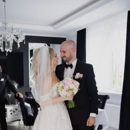 Wedding couple Natalia and Sebastian embracing at scenic location