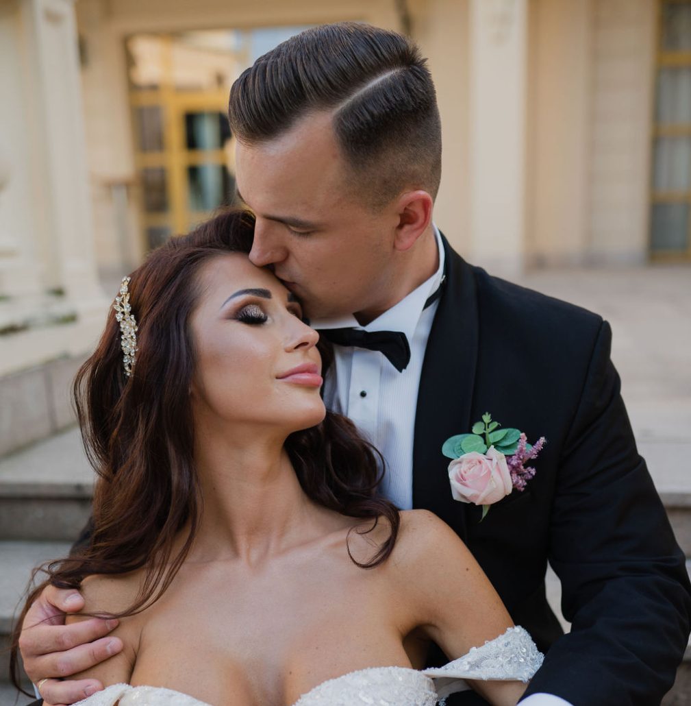 Bride Sylwia and groom Paweł sharing a moment during their wedding ceremony